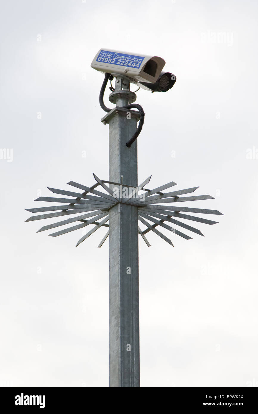 Security Camera on top of a guarded pillar Stock Photo