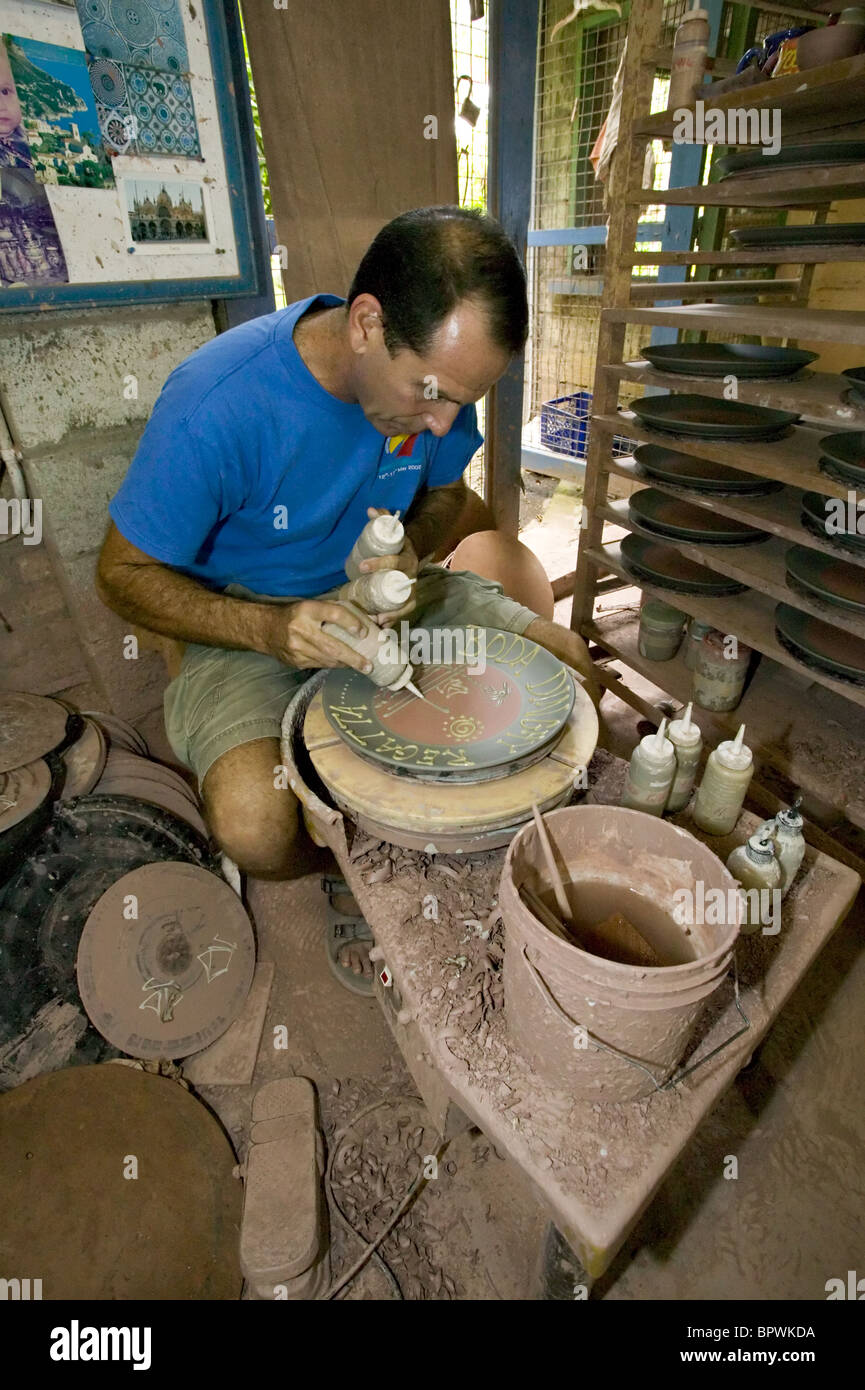 David Spieler working on presentation plate at the Earthworks Pottery in the parish of Saint James Stock Photo
