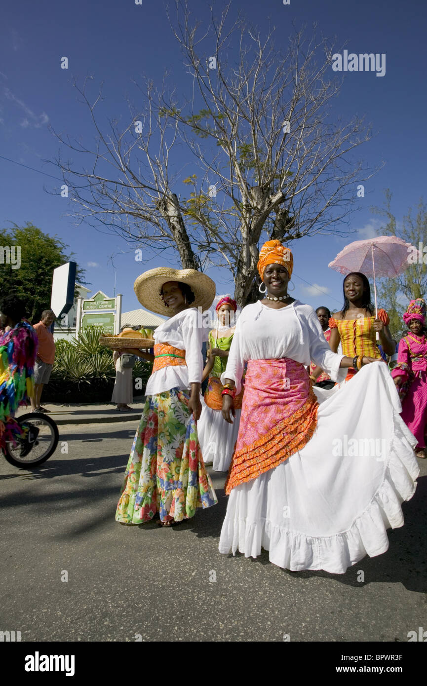 People in brightly coloured costumes for the Holetown Festival - The ...