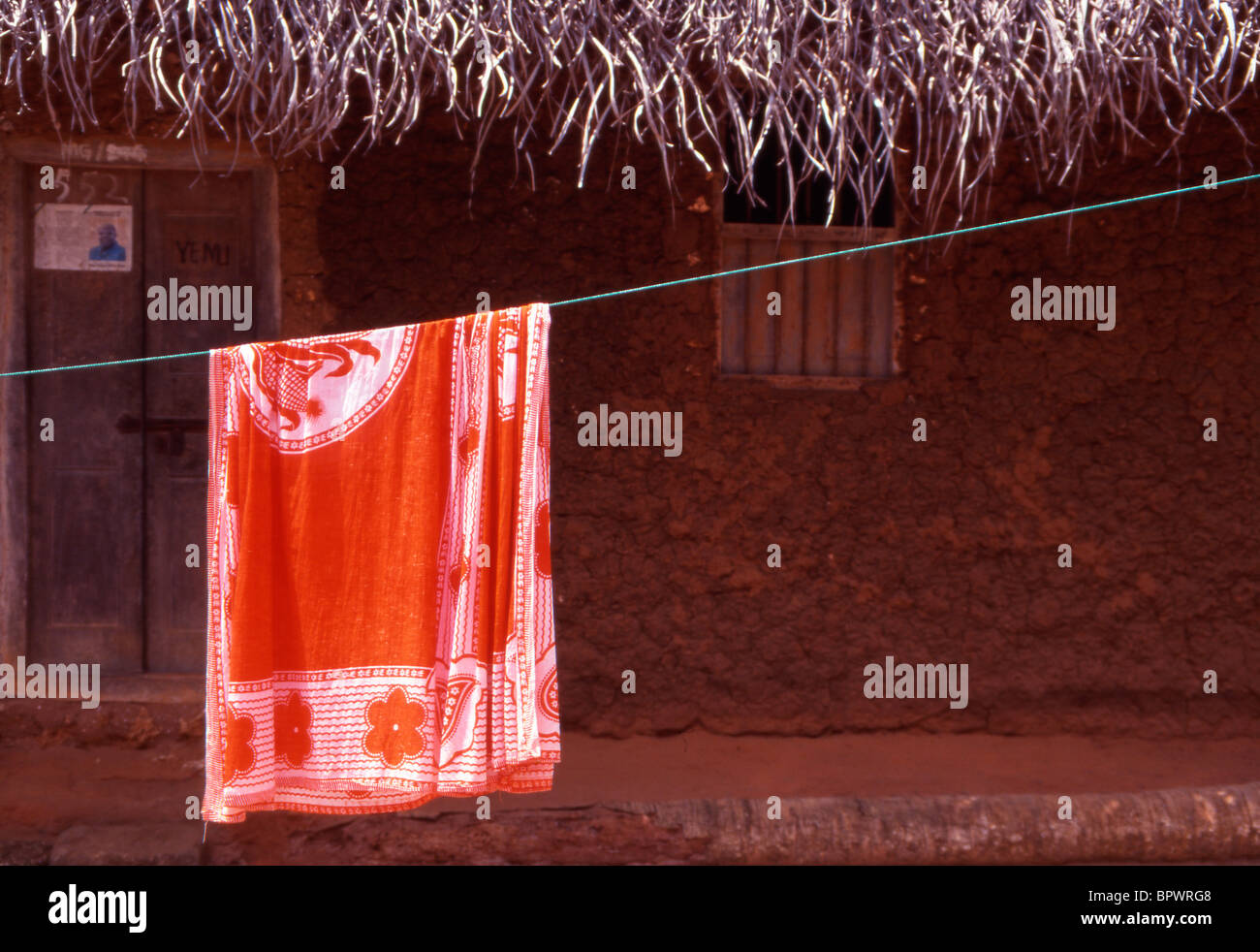 Village life. Khanga hanging on a washing line to dry. Stock Photo
