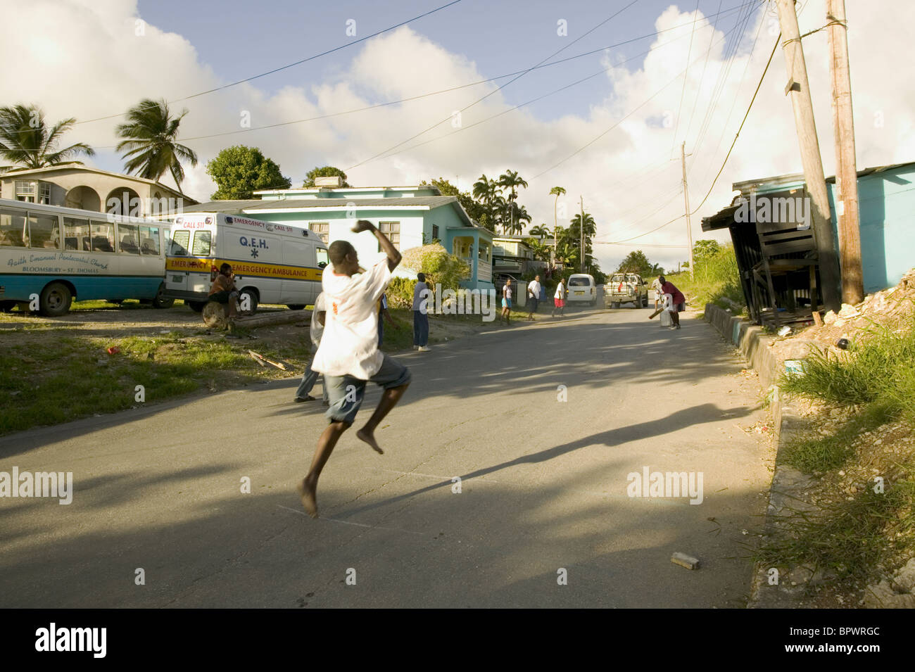 Street cricket in the small hamlet of White Hill in parish of St. Andrews Stock Photo