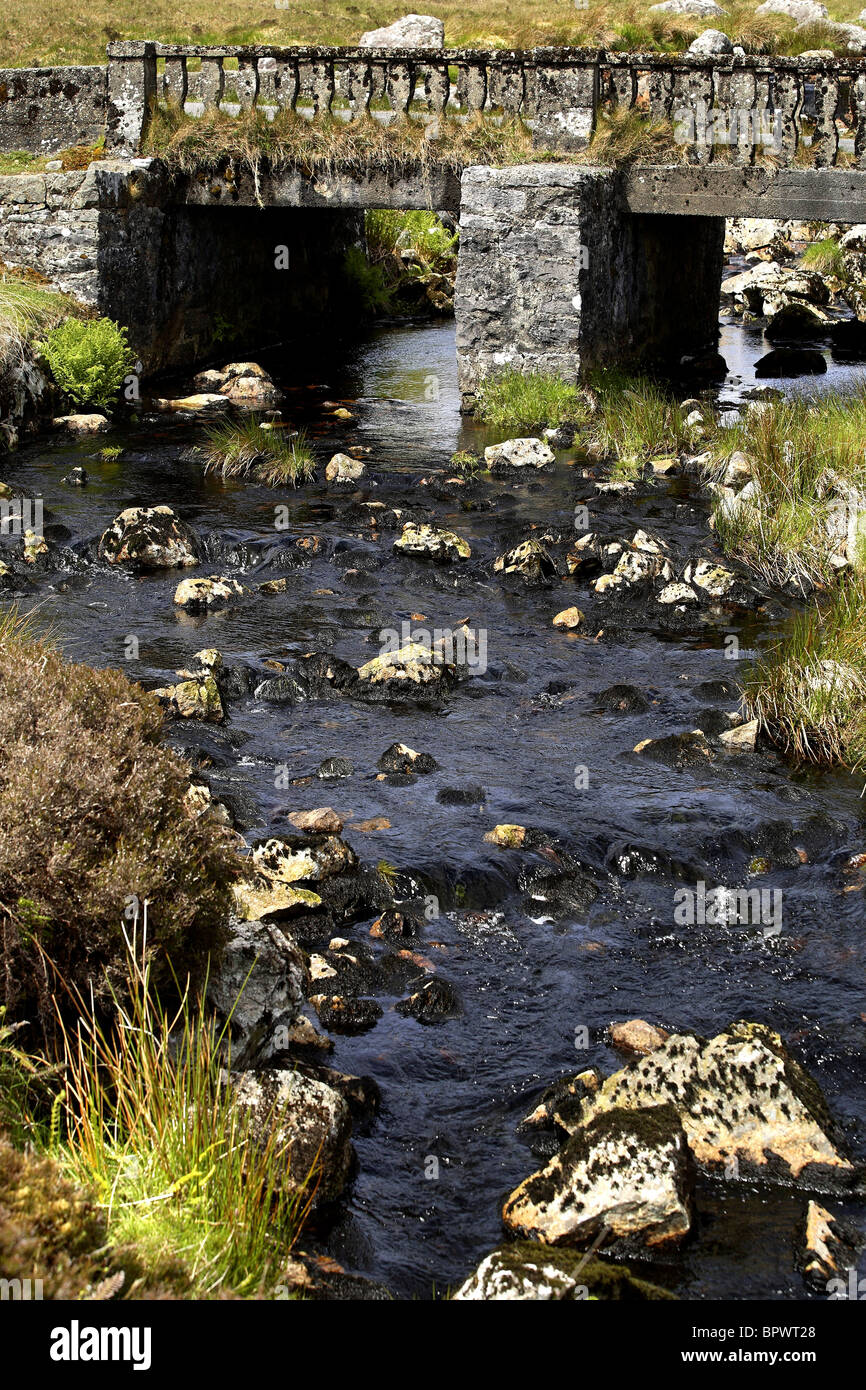 Water Stream under Old Concrete Traffic Bridge Connemara, County Galway Ireland Stock Photo