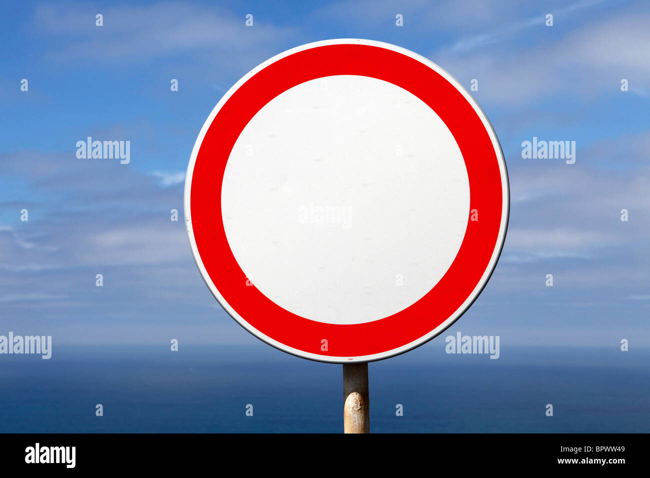 A white sign with a red ring means that traffic is prohibited to drive on  this seaside street Stock Photo - Alamy