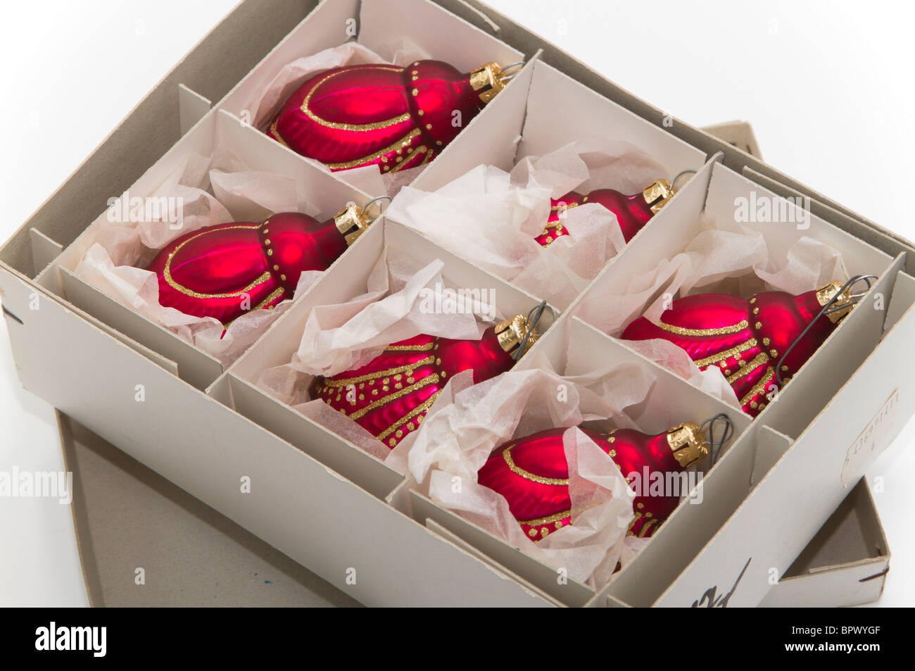 Open box of beautiful hand made red glass Christmas ornaments Stock Photo