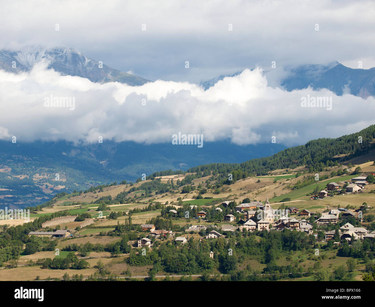 Les Orres, Hautes Alpes, France small village in the Alps at 1600m altitude with nice clouds Stock Photo