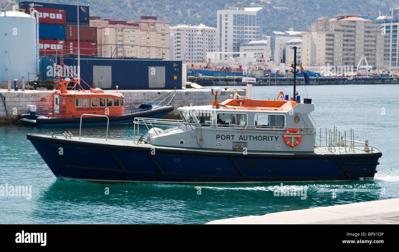 Gibraltar port authority boat and pilot launch at the docks Stock Photo