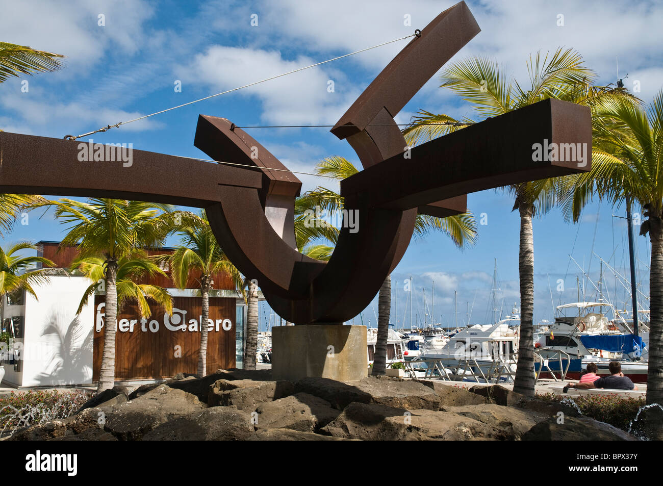 dh Puerto Calero harbour PUERTO CALERO LANZAROTE Marina waterfront fountain sculpture Stock Photo