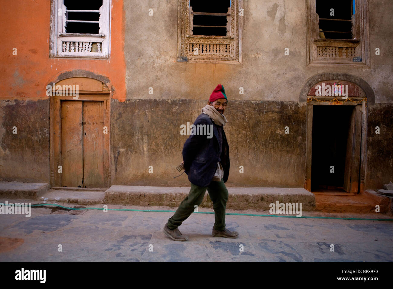 Man walking in street Dhulikel Nepal Asia Stock Photo