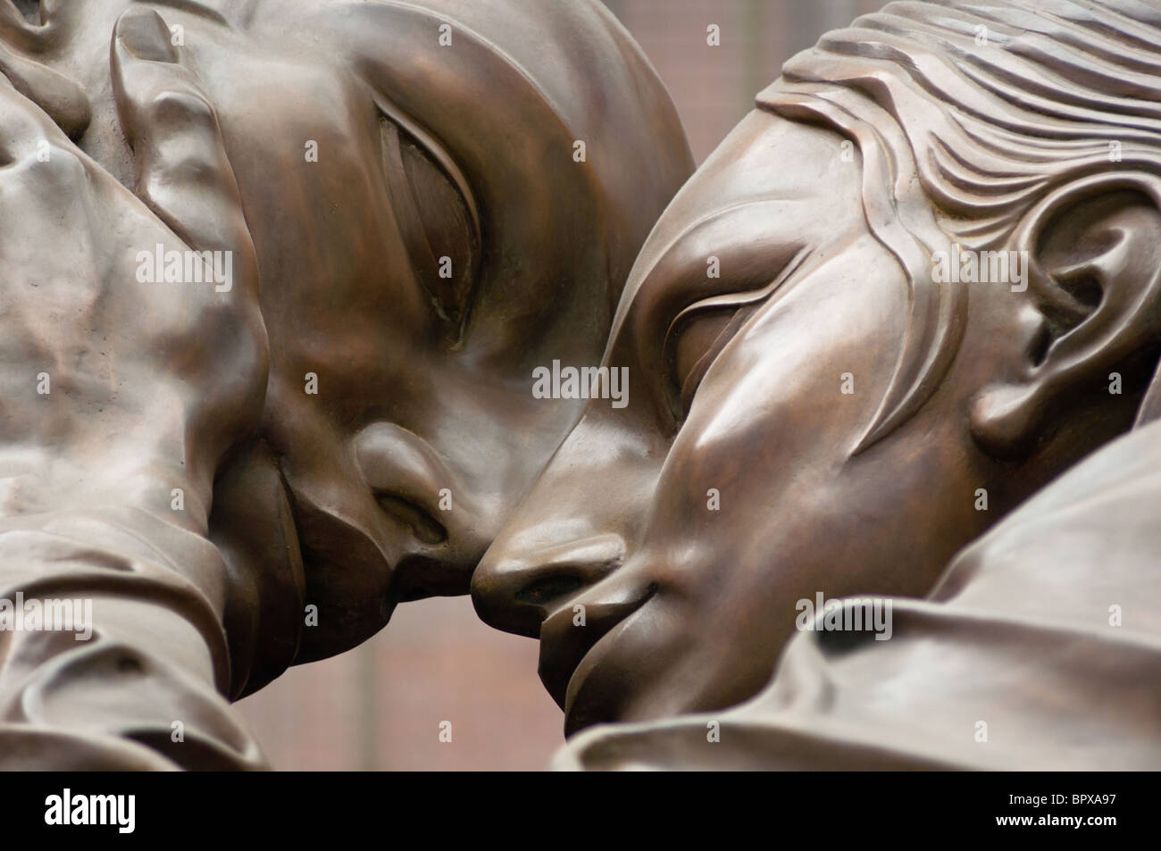 Close up detail of 'The Meeting Place', a 30 foot bronze statue, St Pancras Railway Station, London Stock Photo