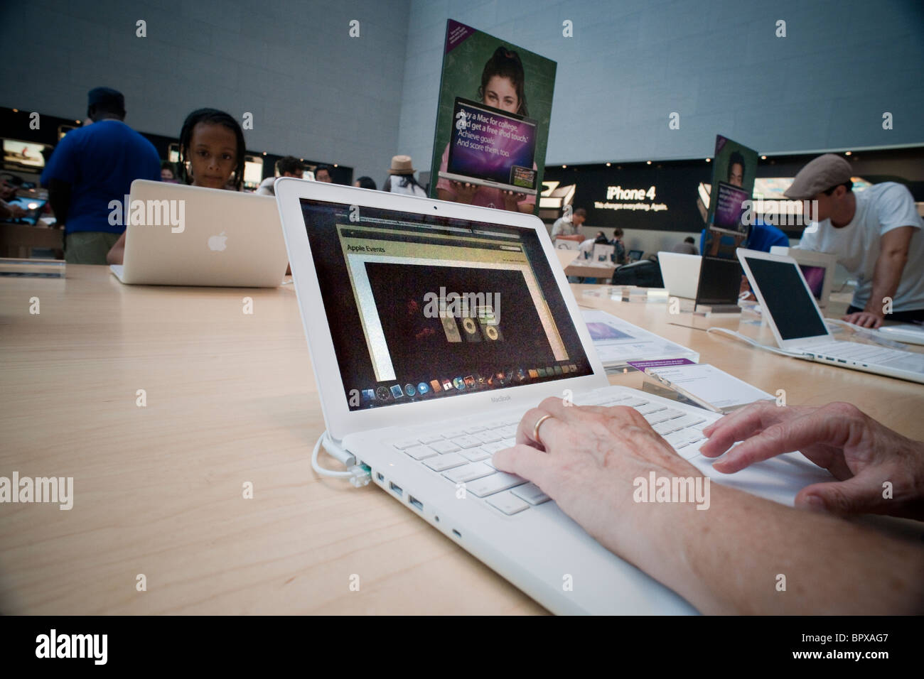 A Customer at an Apple Store Looking at His IPhone while Waiting at an Apple  Store Editorial Photo - Image of imac, computer: 237668441