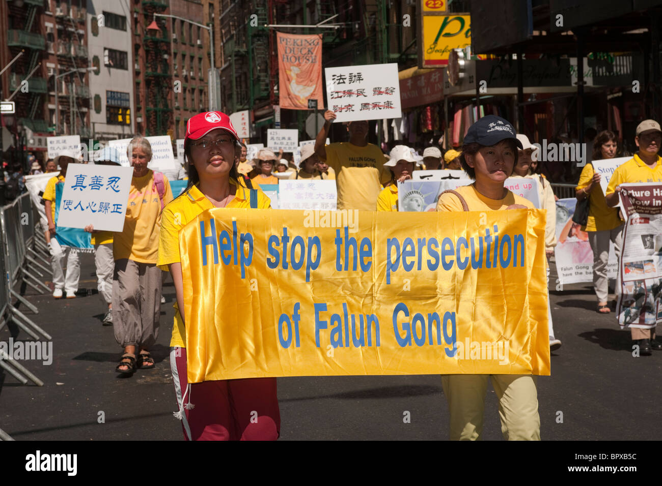 Members of Falun Dafa (Falun Gong) from around the world parade through