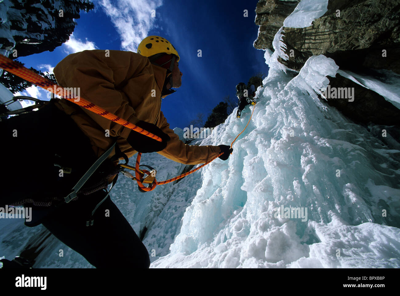 Belaying an ice climber, Colorado Stock Photo Alamy