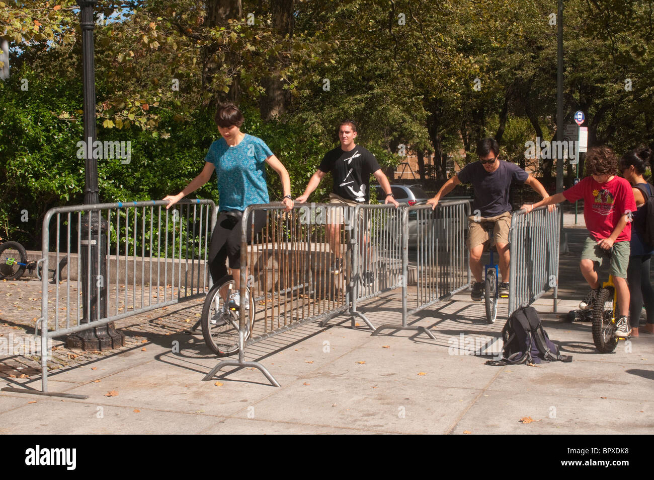 People learning how to ride unicycles Stock Photo Alamy