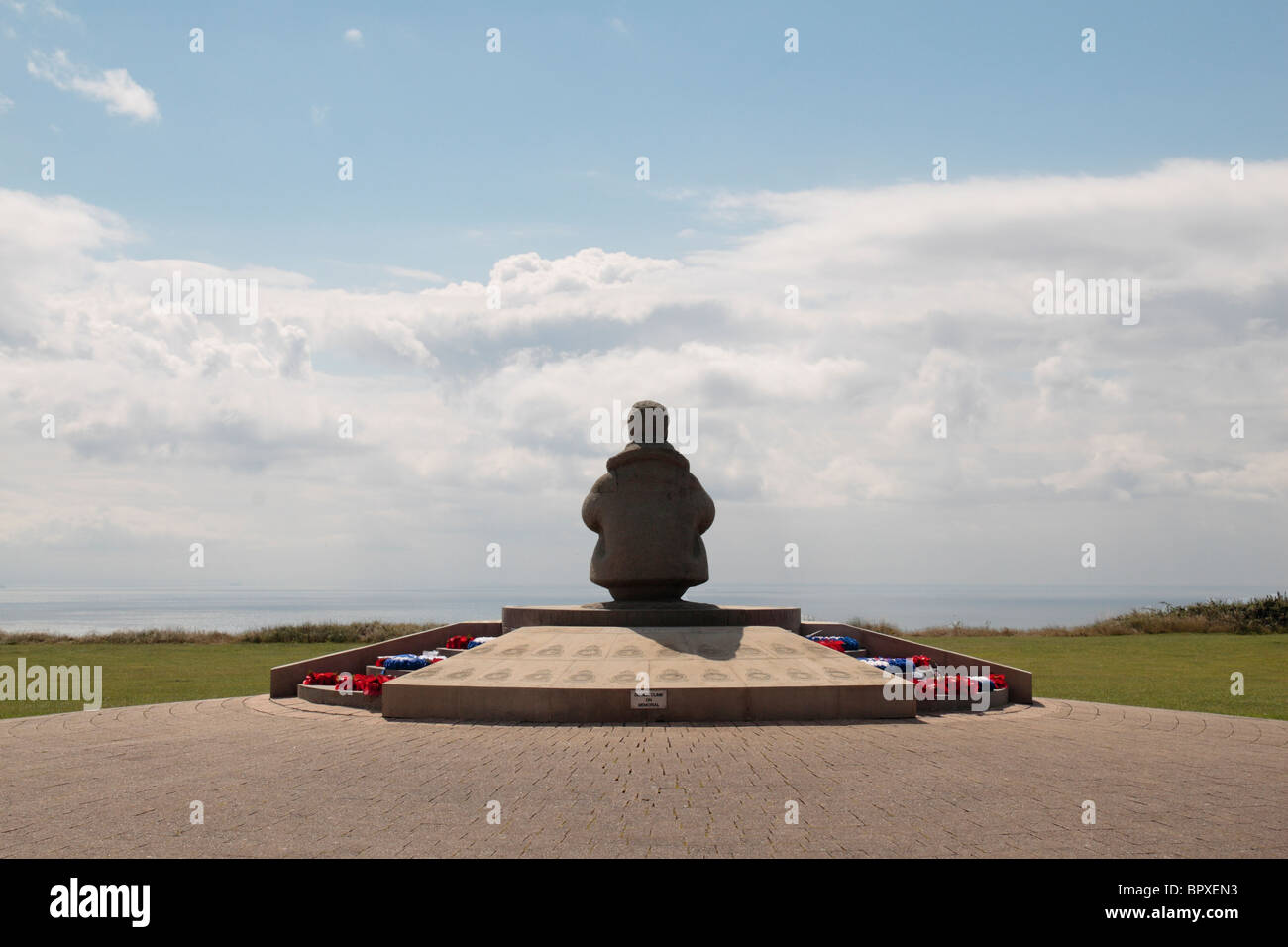 The seated airman statue at the centre of the Battle of Britain Memorial at Capel le Ferne, Kent, UK. Stock Photo