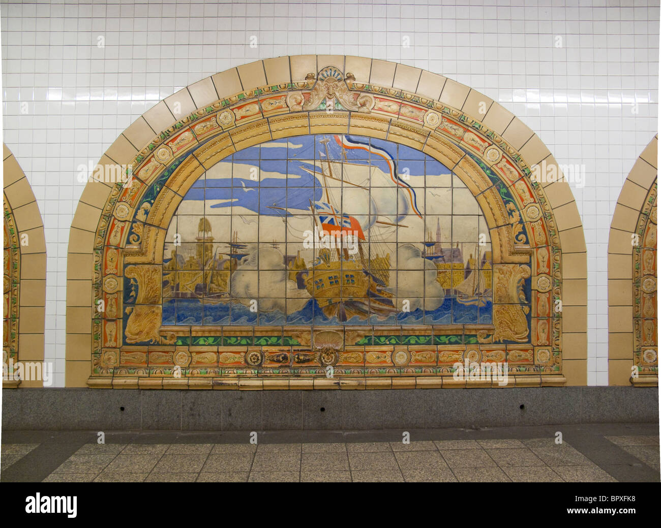 Nassau street subway station tile murals depicting British ships firing their canons  in New York Harbor Stock Photo