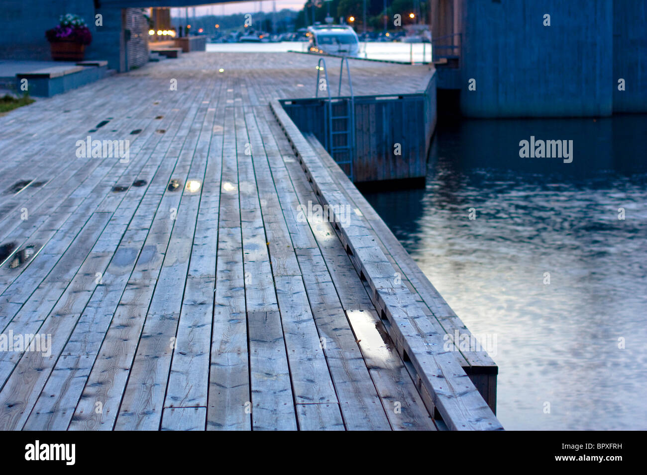 A wooden boardwalk at dusk in Tonsberg, Norway. Stock Photo