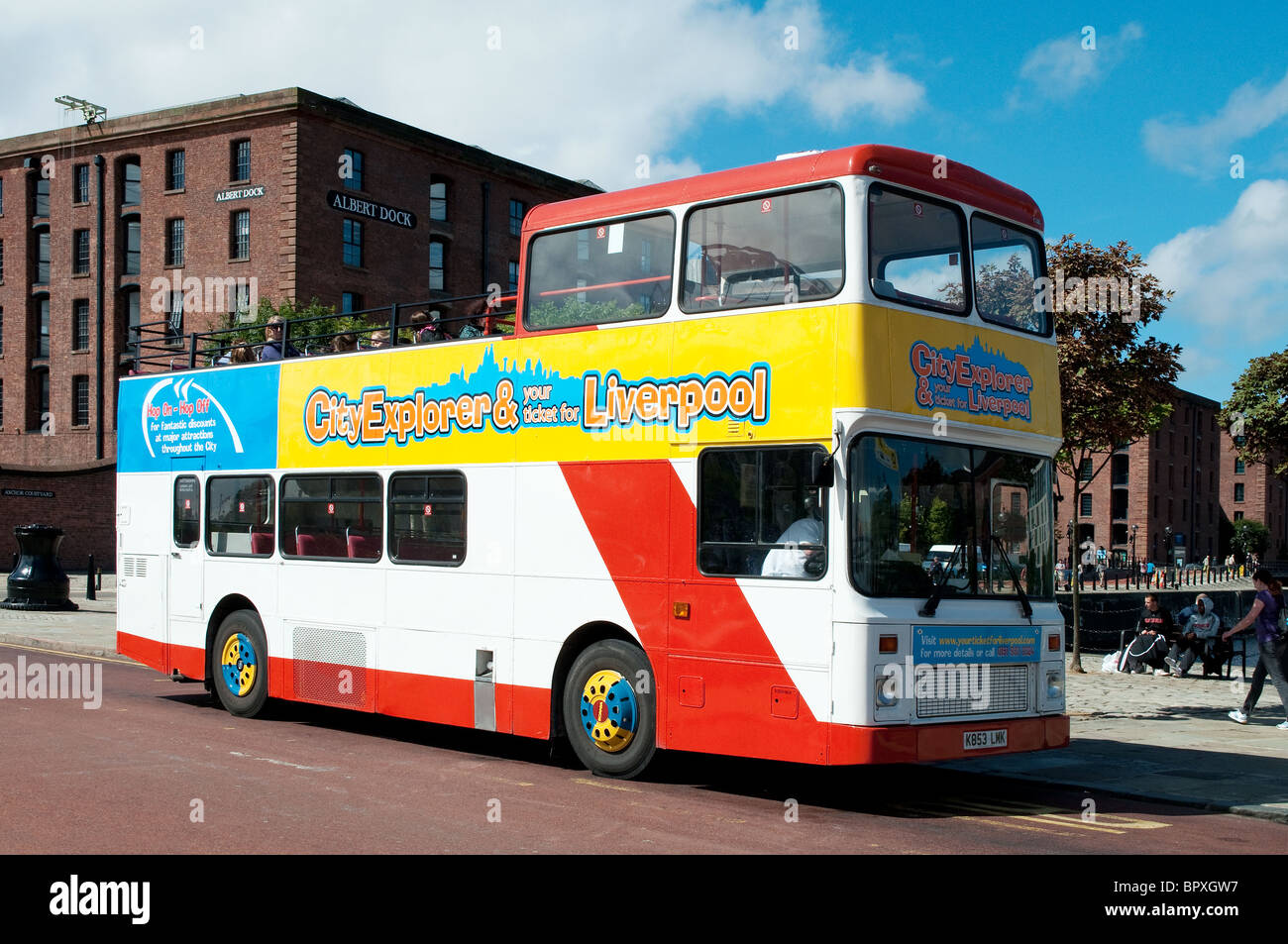 a city tour bus parked at the Albert docks in Liverpool, UK Stock Photo