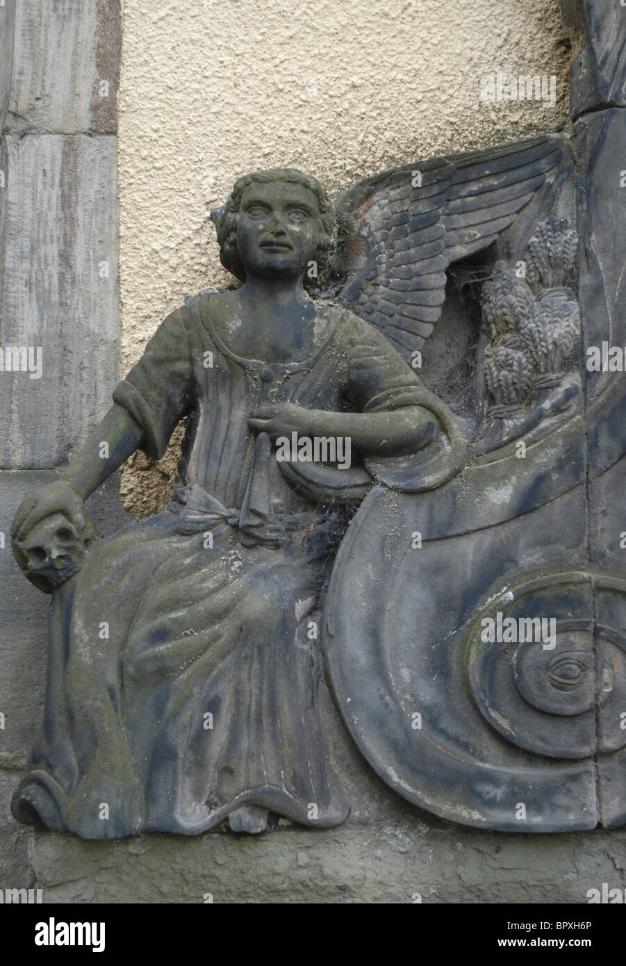 Detail from a memorial in Greyfriars Kirkyard, Edinburgh showing an angel holding a skull. Stock Photo