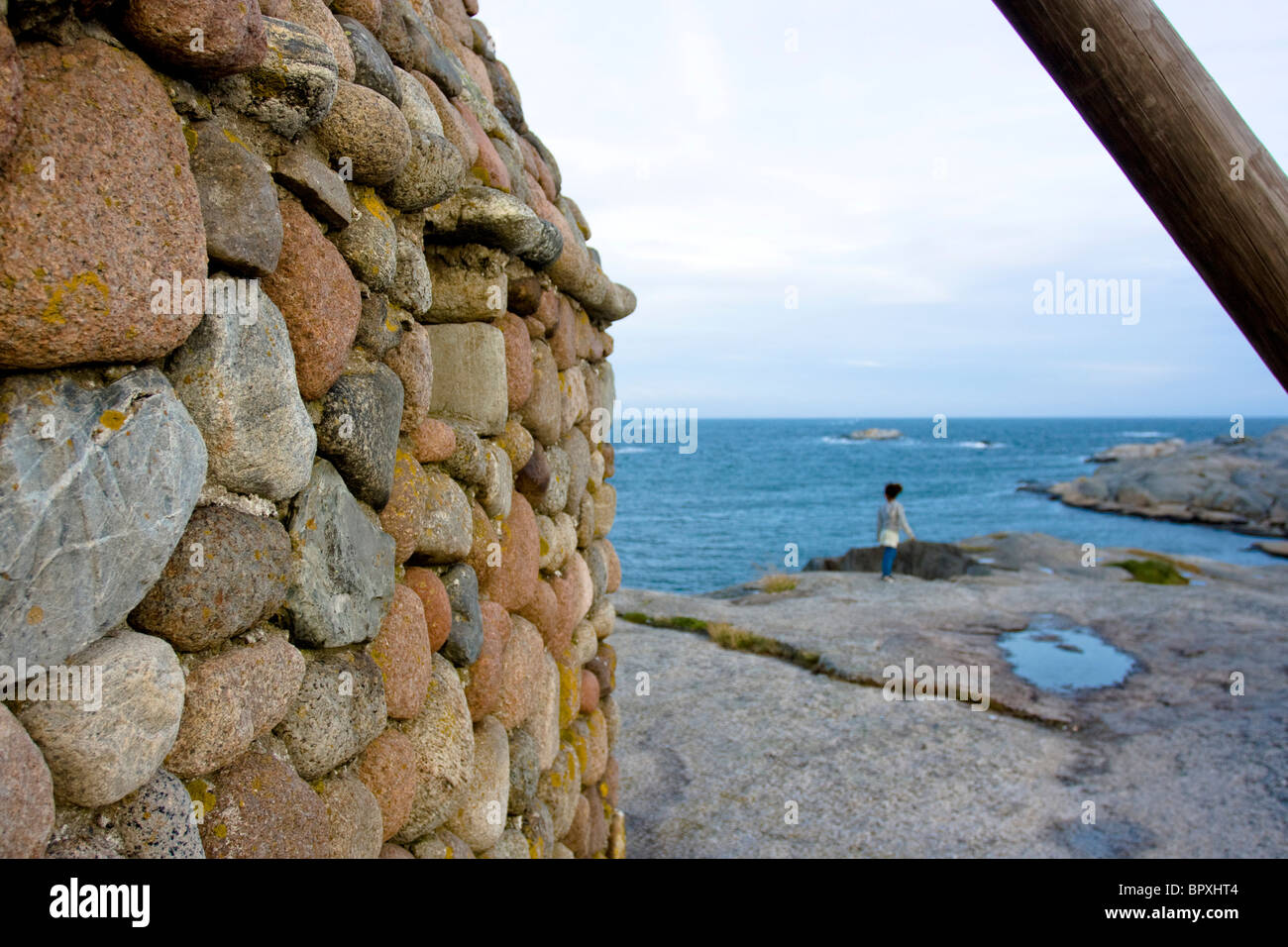 A traditional stone lighthouse on the coast at Verdens Ende, Tjome, Norway. Stock Photo