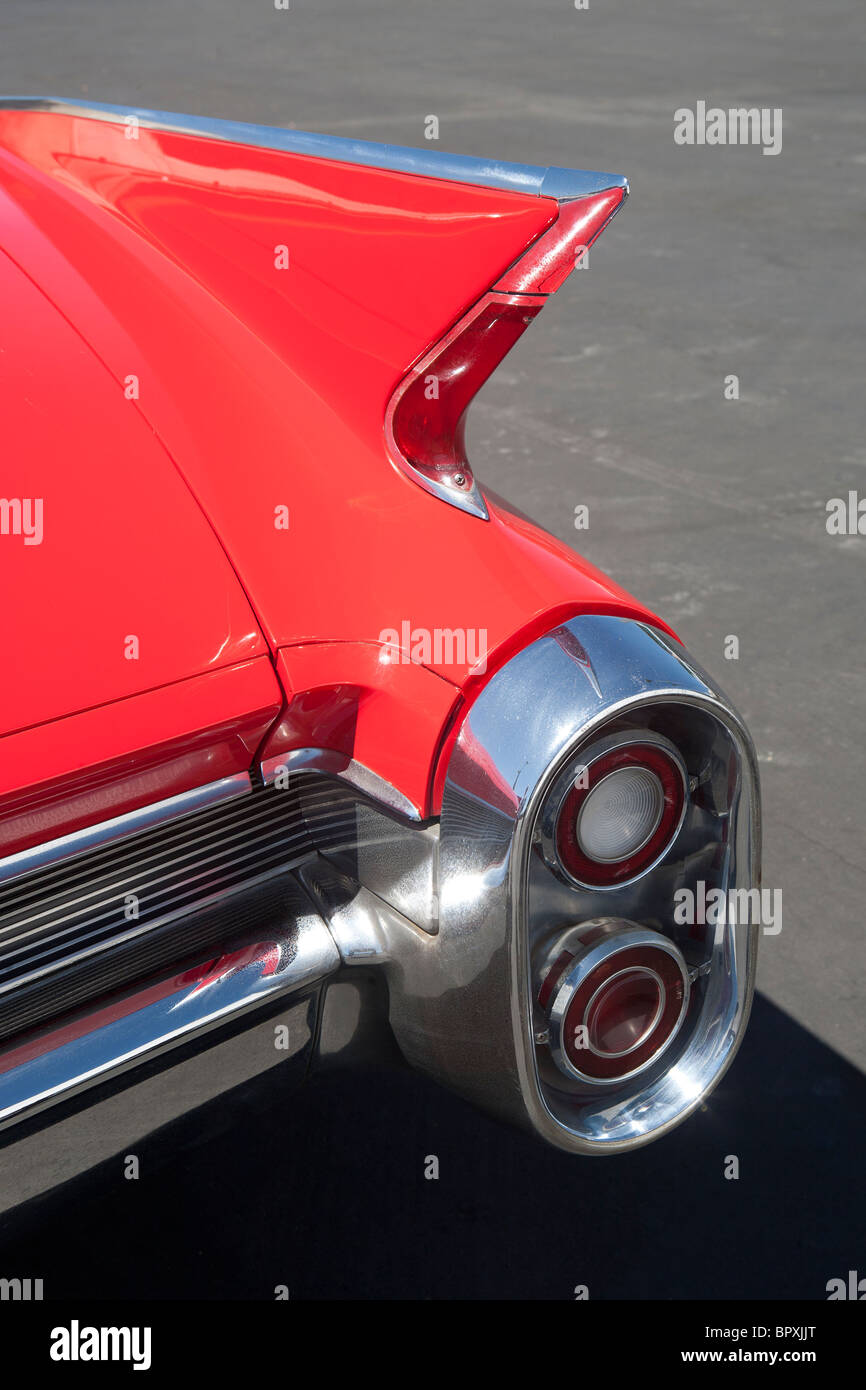 detail of red Cadillac showing fin and round tail light Stock Photo