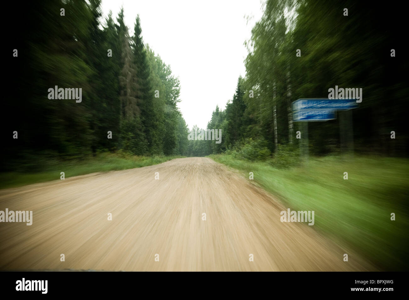 Speedy driving in gravel road Stock Photo