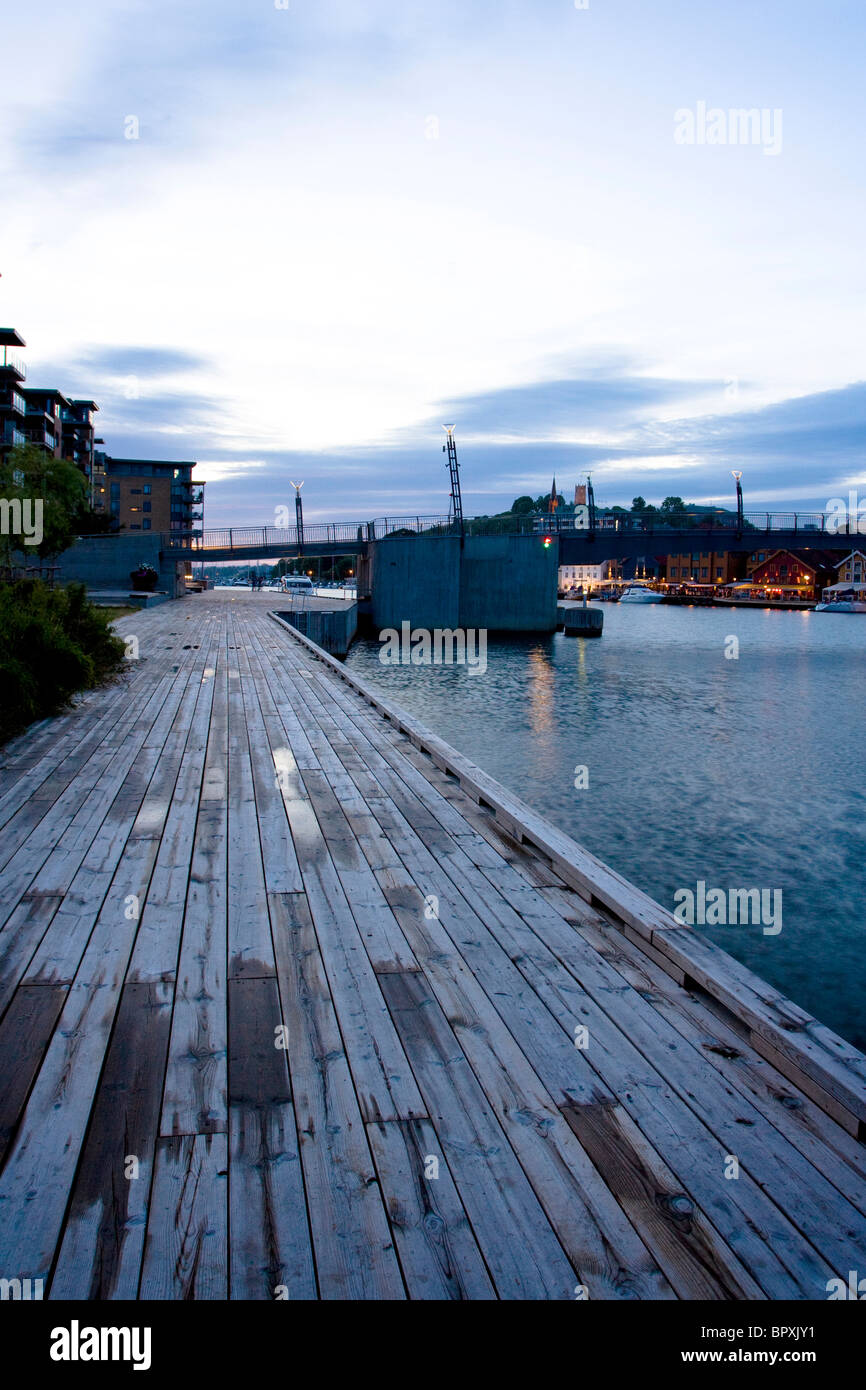 A wooden boardwalk at dusk in Tonsberg, Norway. Stock Photo