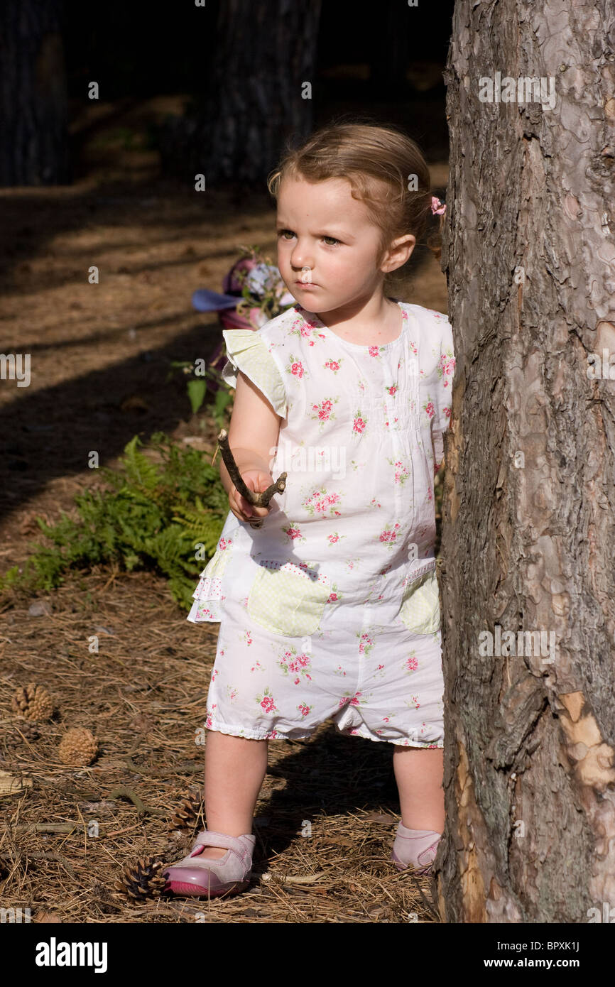 toddler little girl playing wood playful playtime Stock Photo