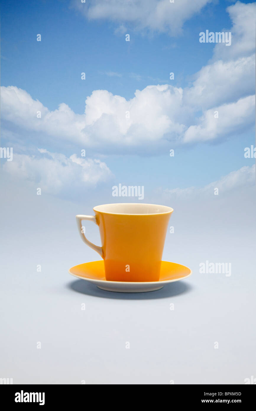coffee cup floating on the clouds Stock Photo