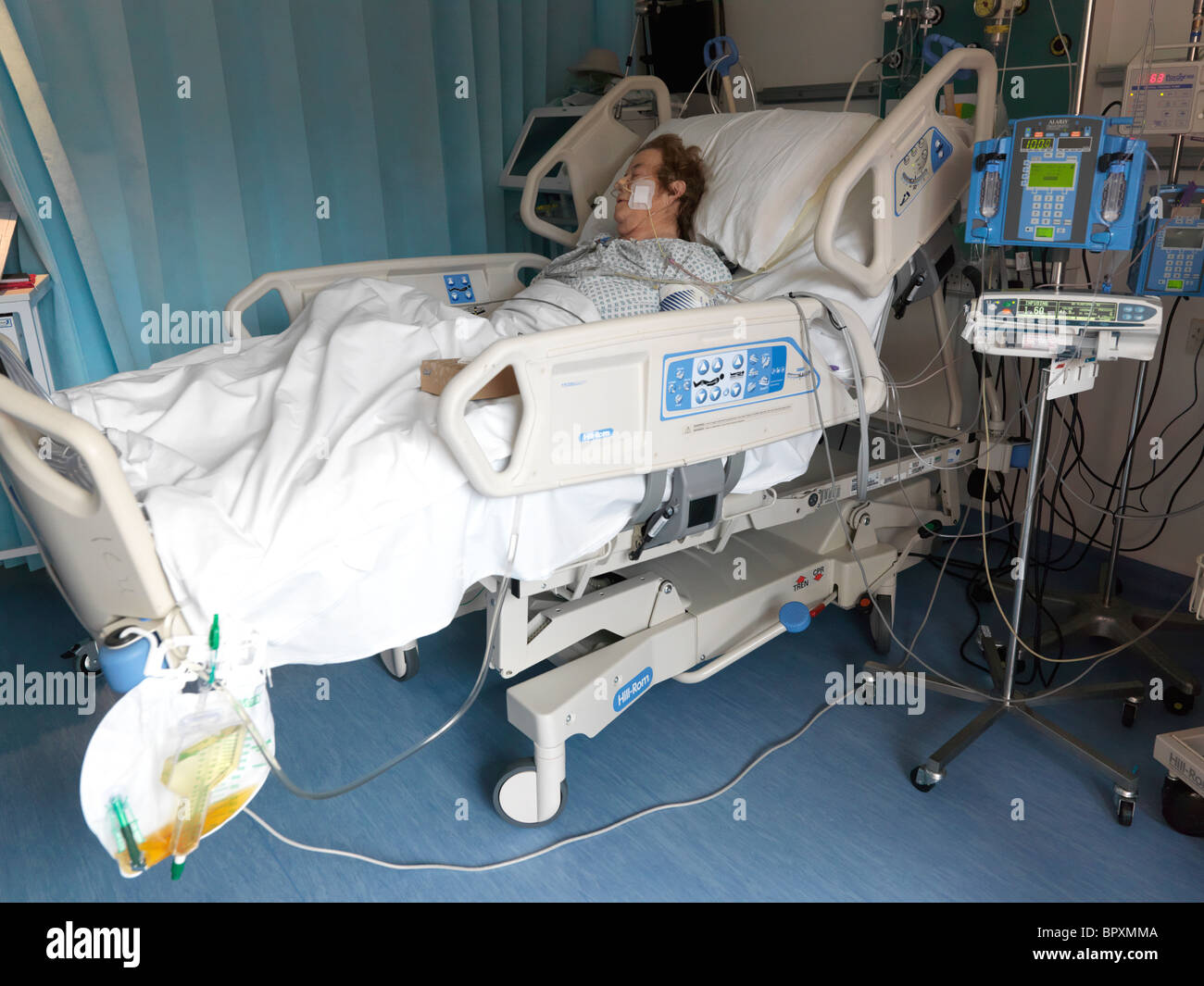 London England Private Intensive Care Unit Elderly Woman In Hospital Bed Stock Photo