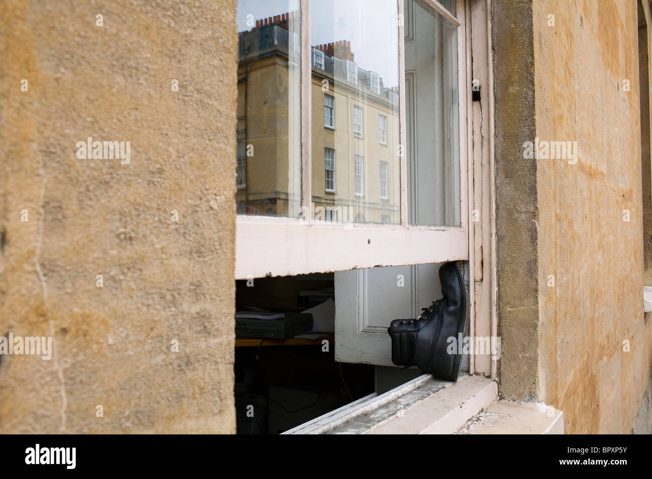 A black boot props open a window Stock Photo Alamy