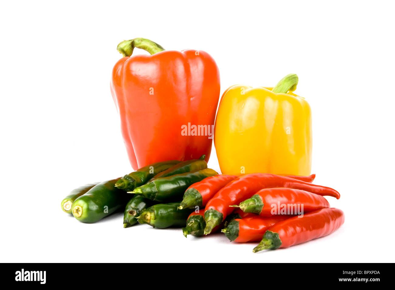 Red and green chili peppers on white background Stock Photo - Alamy