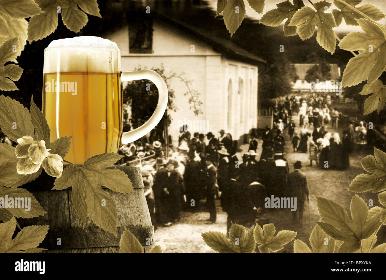 Glass of beer, old barrel and hop plant on background of festive rural scene one hundred years ago Stock Photo