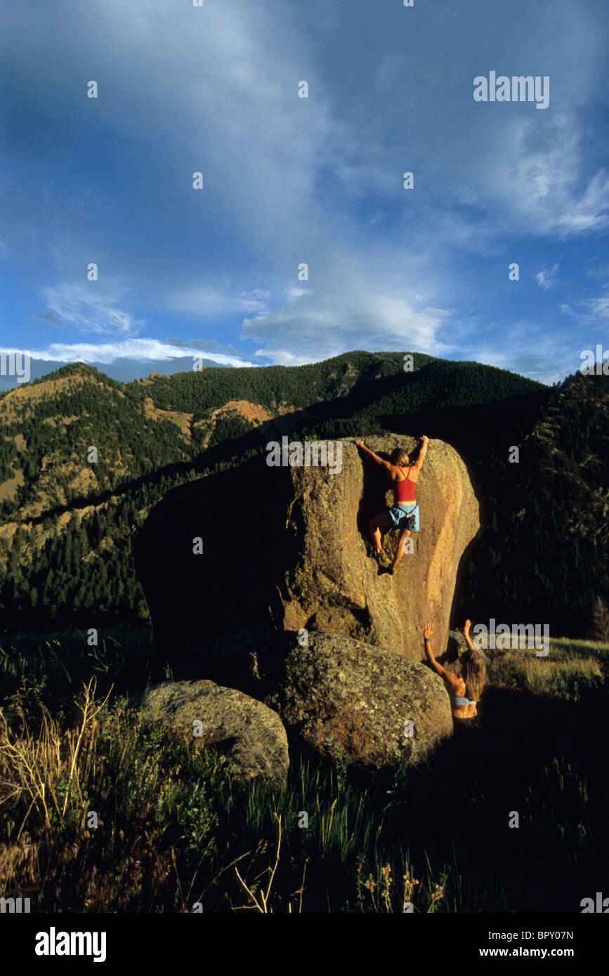 Two woman bouldering in Eldorado Canyon, Colorado. Stock Photo