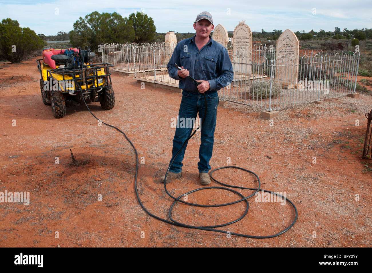 Herbicide sprayer in the historical cemetery at Silverton outside Broken Hill in outback New South Wales Stock Photo