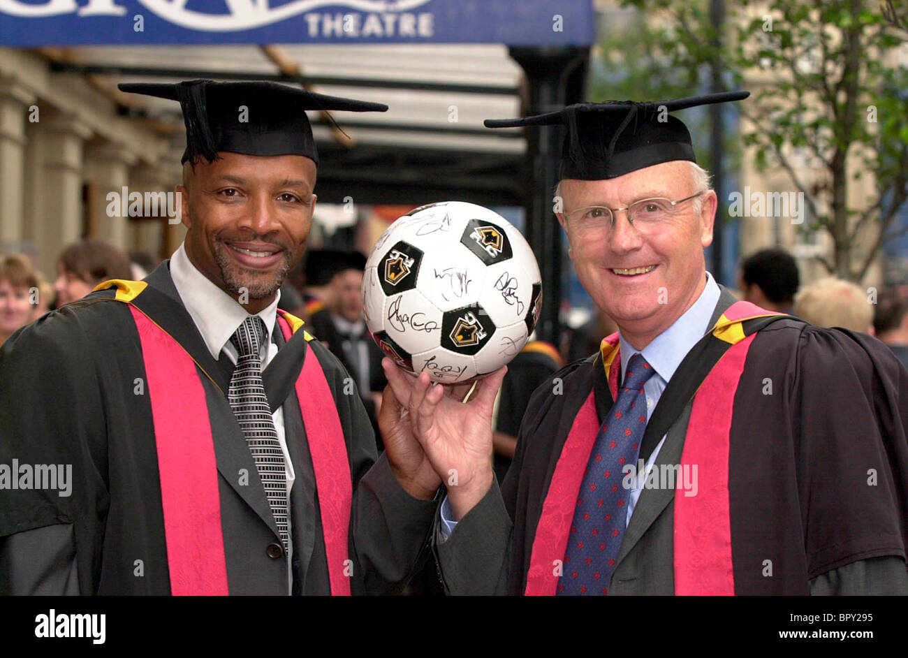Former footballers Cyrille Regis and Don Howe after collecting their honorary degrees at Wolverhampton University 2001 Stock Photo