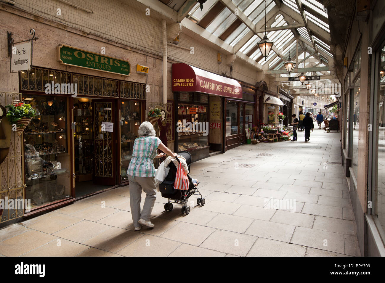 UK, England, Merseyside, Southport, Lord Street, shops in Cambridge Arcade covered shopping area Stock Photo