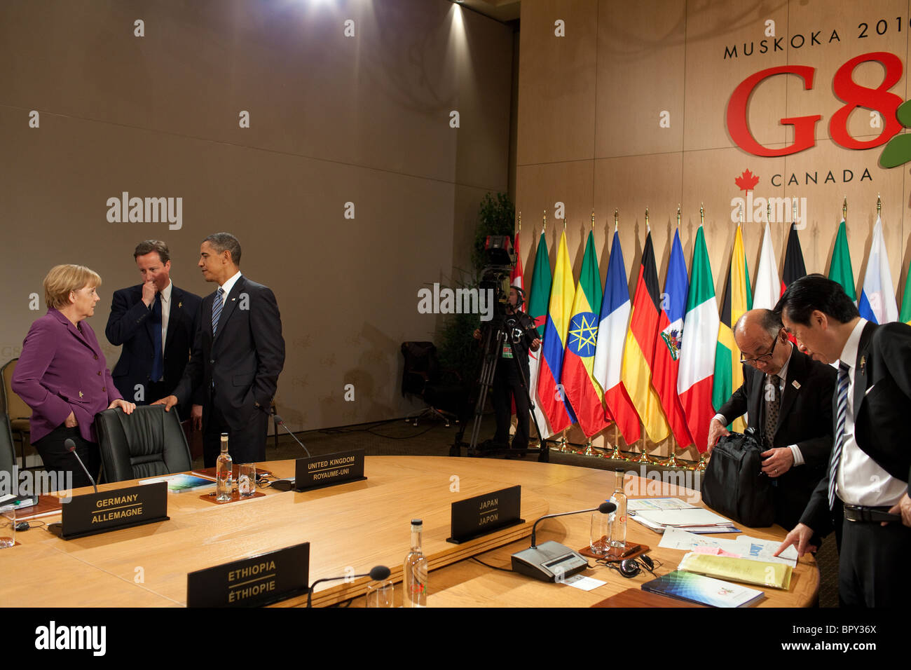 Obama talks with British Prime Minister David Cameron and German Chancellor Angela Merkel at the G8 Summit Stock Photo