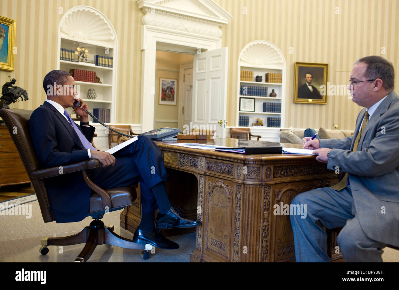 President Barack Obama talks on the phone with Federal Emergency Management Agency Administrator Craig Fugate Stock Photo