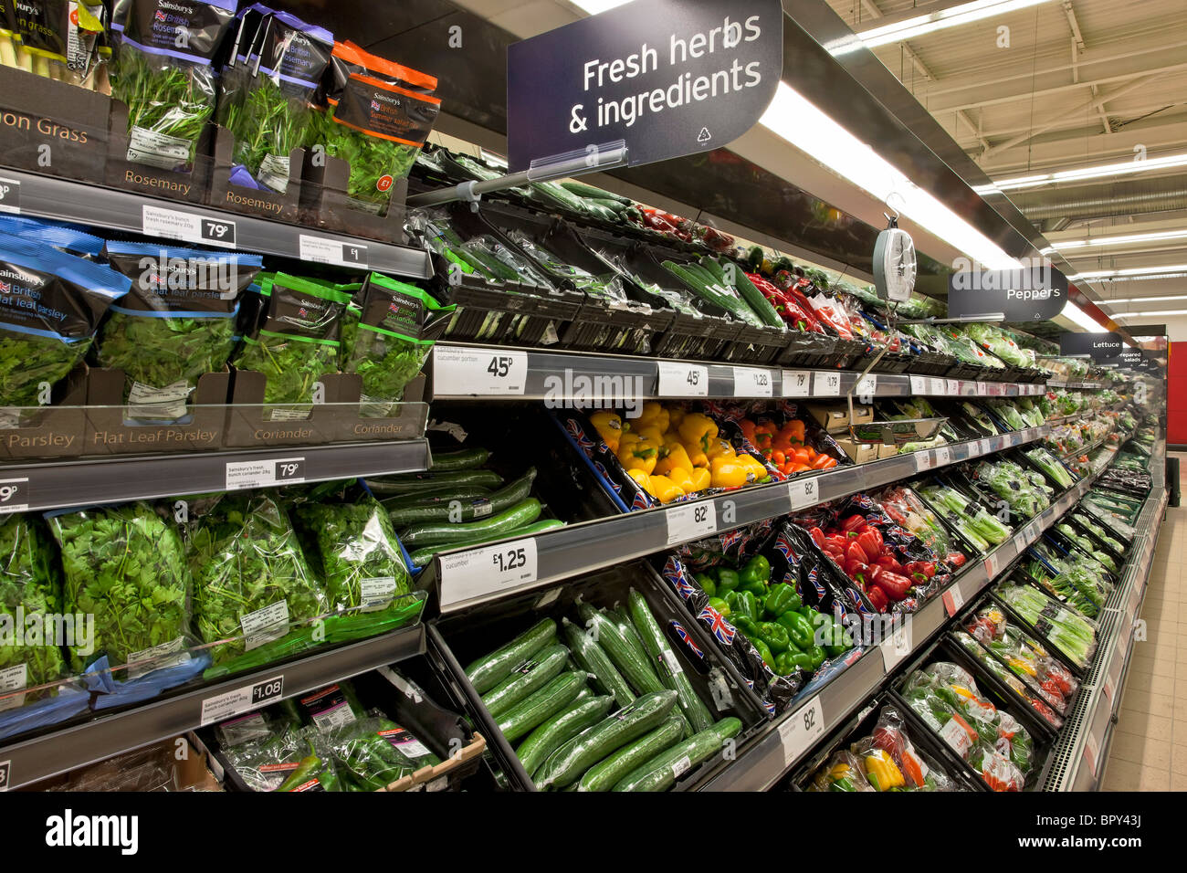 Display of salad and herbs in a supermarket. Stock Photo