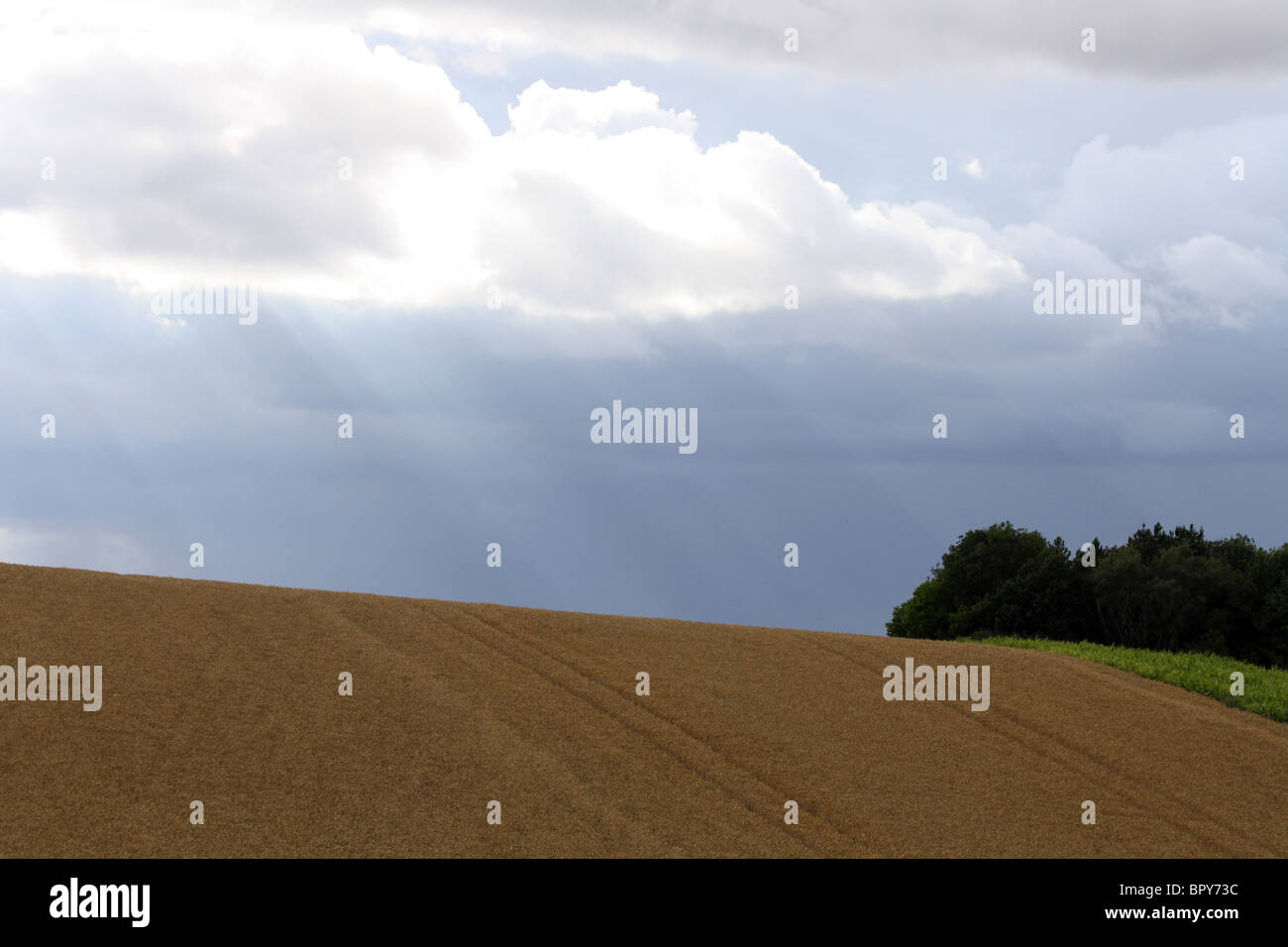 Sun shining through clouds in Oxfordshire Stock Photo