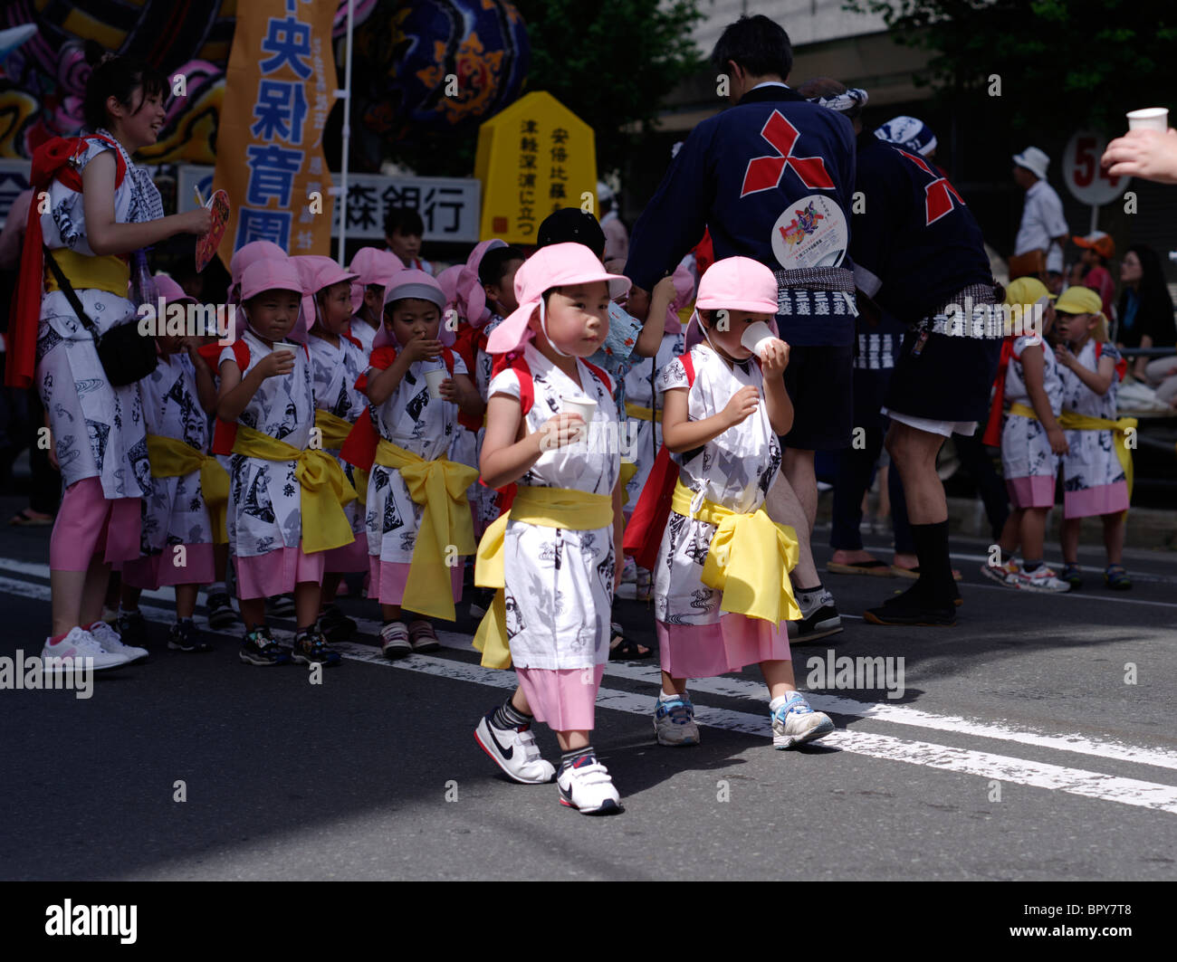 Japanese elementary school children at Nebuta Matsuri summer festival of giant floats, Aomori City, Aomori Prefecture, Japan Stock Photo