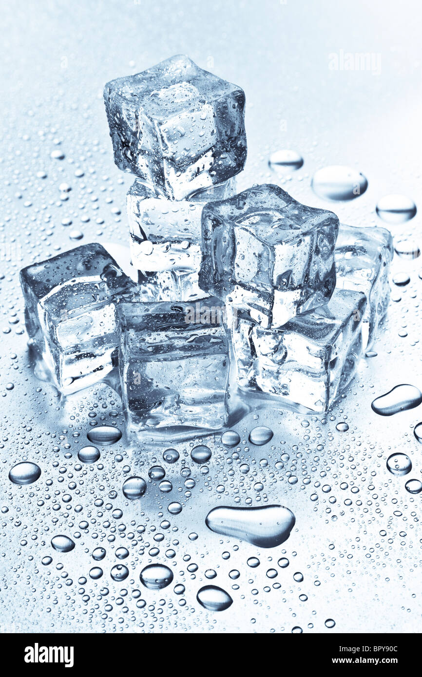 Melting ice cubes on a metal tabletop Stock Photo - Alamy