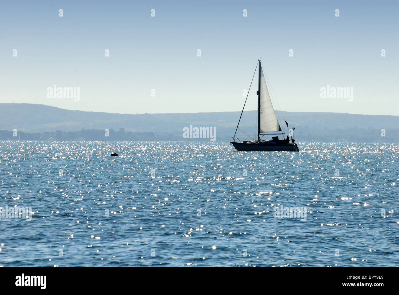 Yachts sailing on a deep blue sea Stock Photo - Alamy