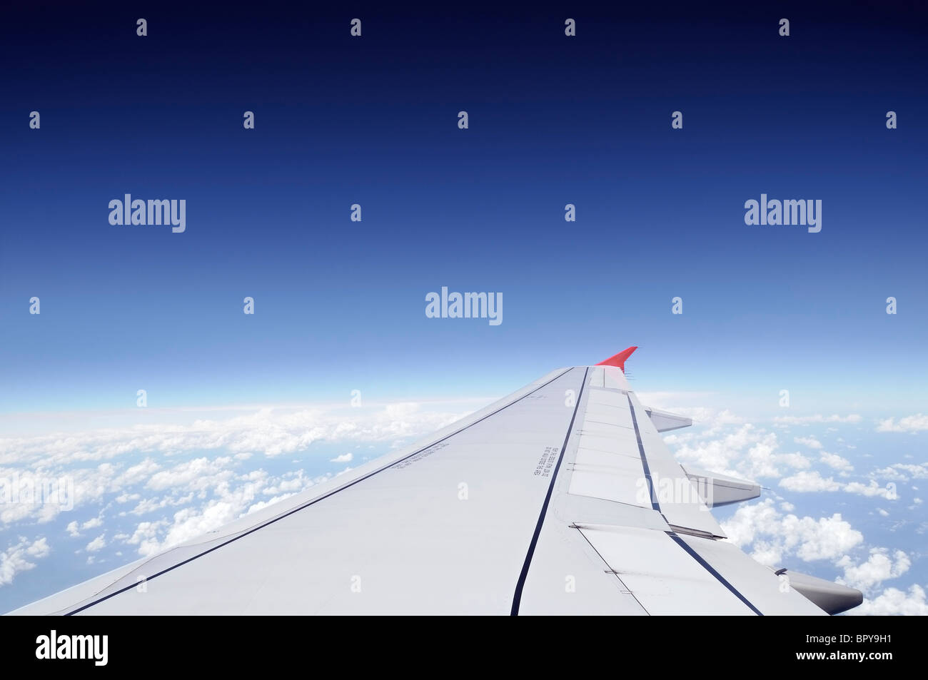 Airplane Wing in Flight Stock Photo