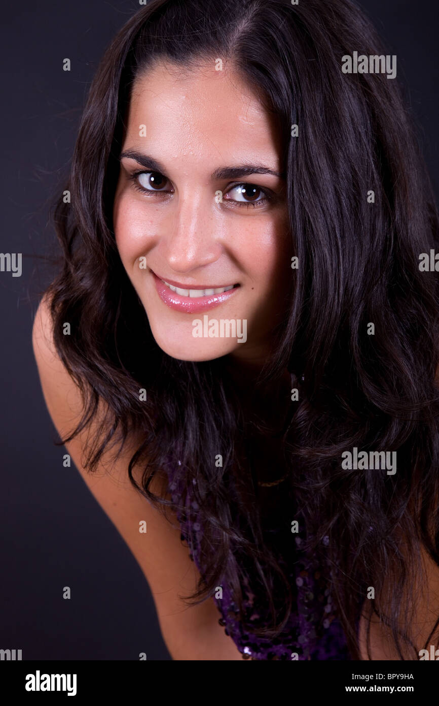 young beautiful woman portrait against black background Stock Photo - Alamy