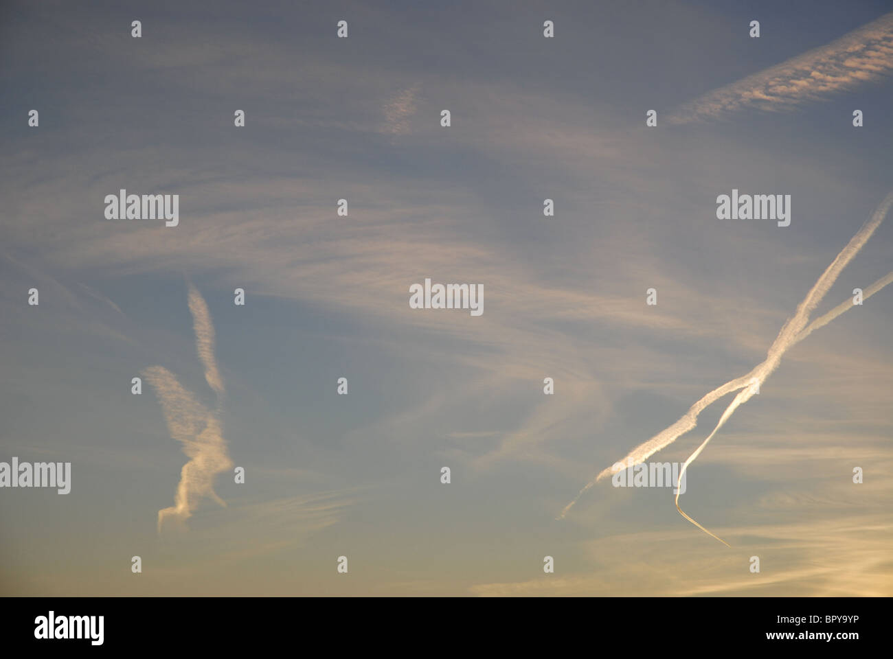 vapour trail in the shape of an X and a Cupid Stock Photo