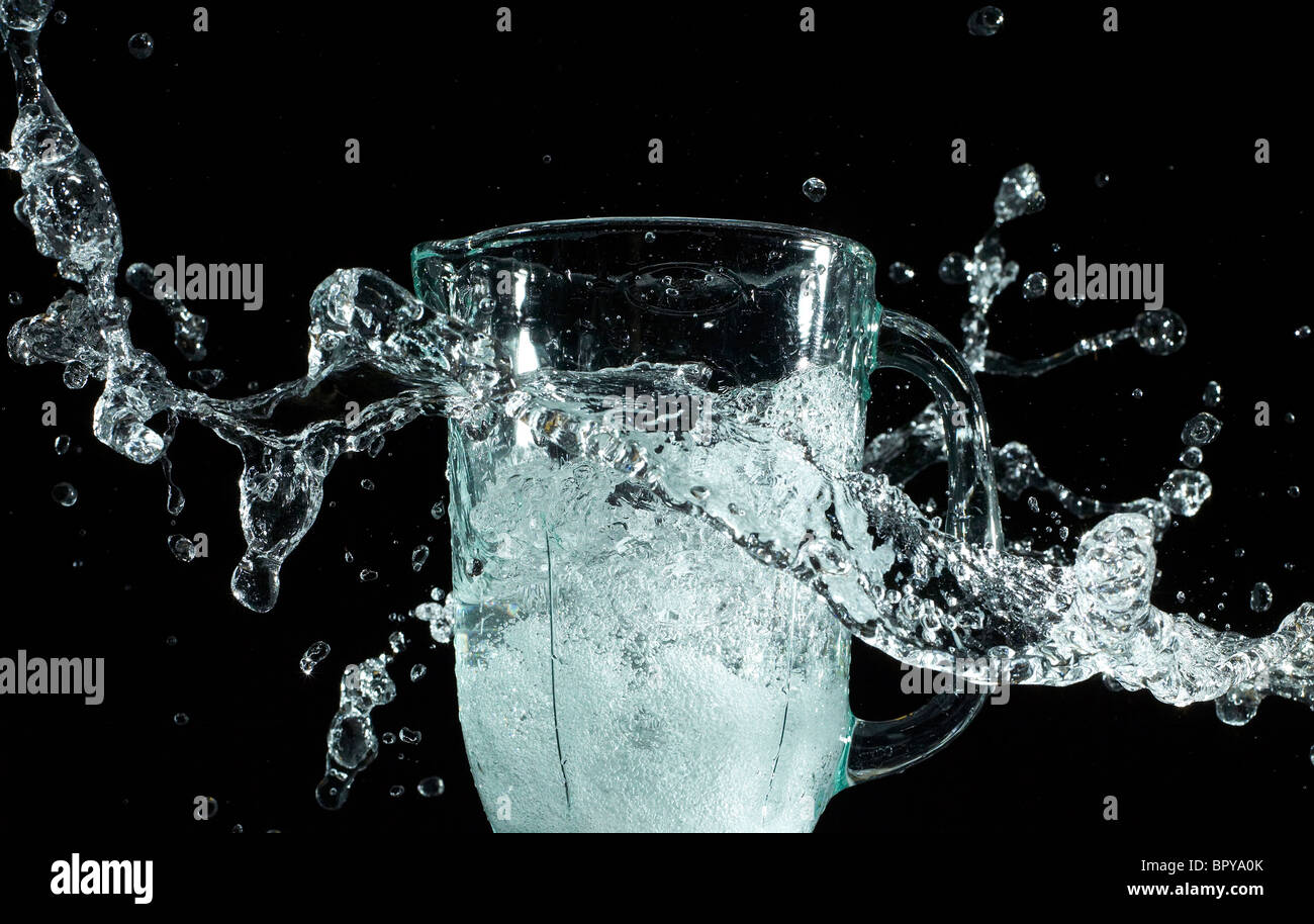 dynamic water splash on a black background Stock Photo