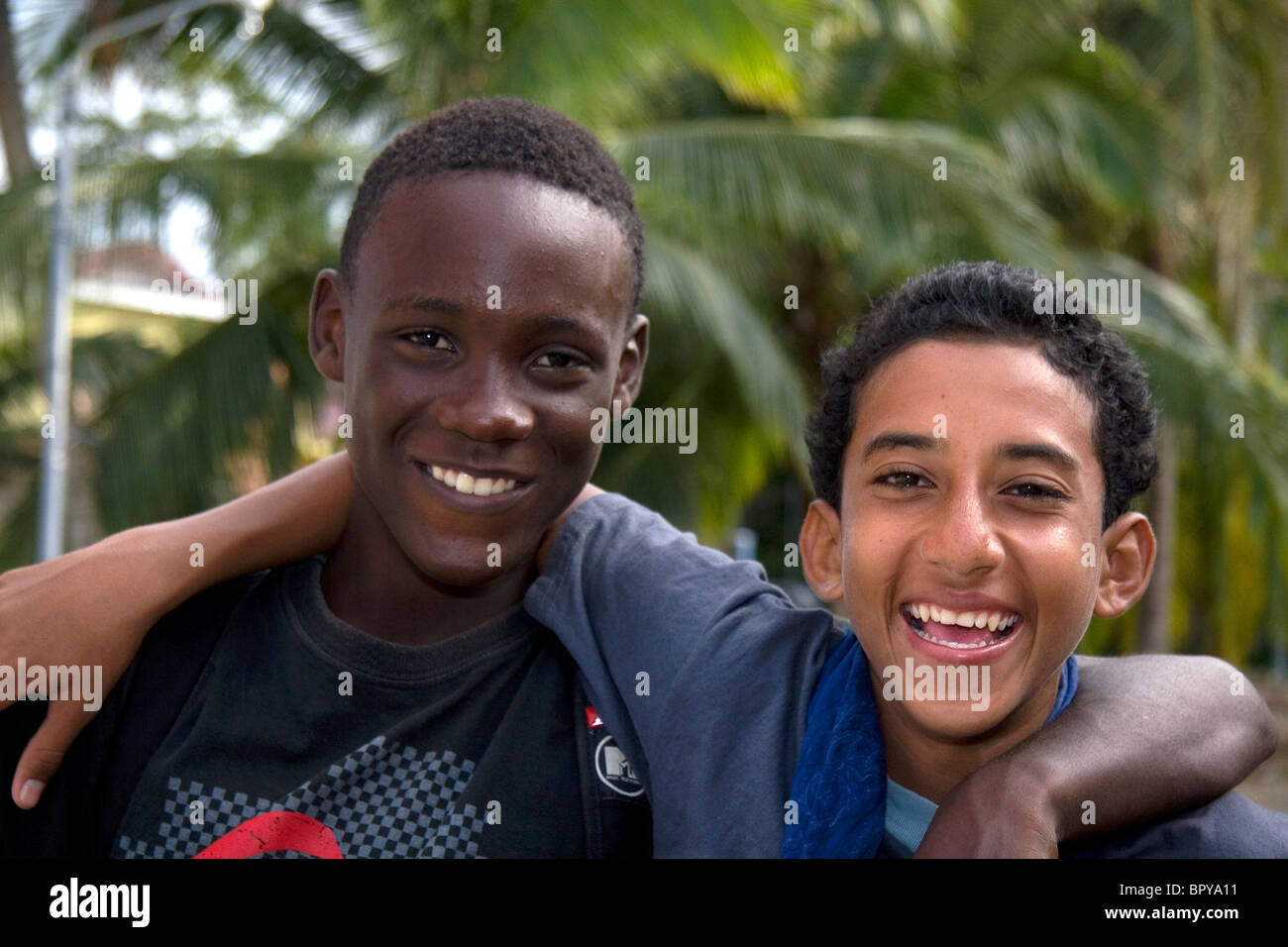 Costa Rican afro-caribbean teen with spanish native teen at Limon, Costa Rica. Stock Photo