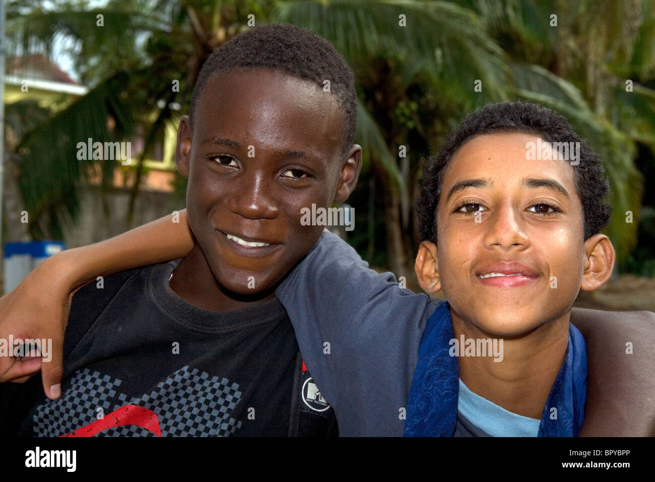 Costa Rican afro-caribbean teen with spanish native teen at Limon, Costa Rica. Stock Photo