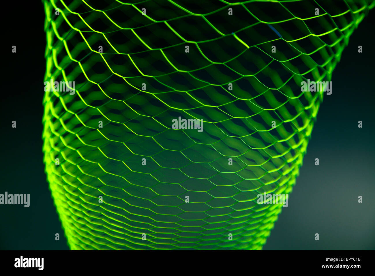 Illuminating wire frame basket with a black background Stock Photo
